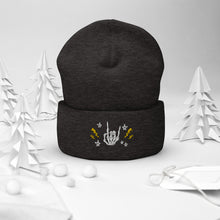 Load image into Gallery viewer, cuffed beanie dark grey, with image design of rock on skeleton hand, pentagram stars, lightning symbols. background: winter themed, Christmas gifts.