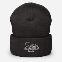 Load image into Gallery viewer, beanie dark grey, with image design of an eye in a cloud, with moon crescent and stars, with the word "Breathe" underneath the image. Front view.