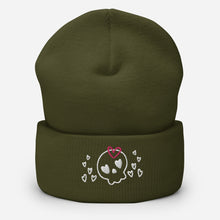 Load image into Gallery viewer, beanie olive green, with image design of a cartoonish cute skull with heart eyes, a heart bow, and stars. Front view.