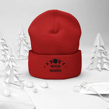 Load image into Gallery viewer, cuffed beanie red, with image phrase "Moon Maiden," and image graphic of moon phases. background: winter themed, Christmas gifts.