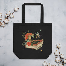 Load image into Gallery viewer, black tote bag, cotton, certified organic, with Image Design: Old book, vial, mushroom, and butterfly with a vintage look