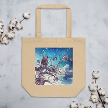 Load image into Gallery viewer, oyster colored tote bag, certified organic. Image design: Design: Watercolor raven and roses, with a light blue and white watercolor background and shooting stars print behind the image