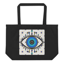 Load image into Gallery viewer, large black colored tote bag with image of eye of protection/evil eye, colors of golden yellow, blue, light blue, third eye, eye, celestial stars. certified organic, cotton.
