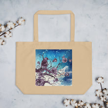 Load image into Gallery viewer, Large oyster colored tote bag, certified organic. Image design: Design: Watercolor raven and roses, with a light blue and white watercolor background and shooting stars print behind the image