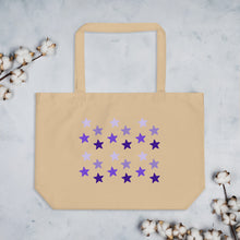 Load image into Gallery viewer, oyster colored tote bag, certified organic, cotton, features rows of purple stars, with each row darker than the one above it, creating a striking gradient effect. 4 shades of purple.
