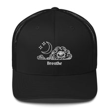Load image into Gallery viewer, retro trucker hat/cap black, with image design of an eye in a cloud, with moon crescent and stars, with the word "Breathe" underneath the image. Front view.