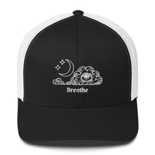 Load image into Gallery viewer, retro trucker hat/cap black white , with image design of an eye in a cloud, with moon crescent and stars, with the word "Breathe" underneath the image. Front view.