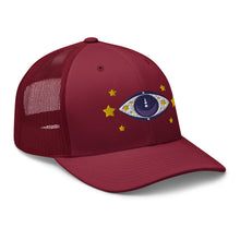 Load image into Gallery viewer, retro trucker hat cranberry red, with image graphic: purple eye of protection/evil eye, with yellow stars. Side view.