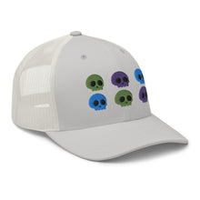 Load image into Gallery viewer, retro trucker hat silver, with image design of 6 purple, green, and blue skulls, 2 of each color, in two rows. side view.