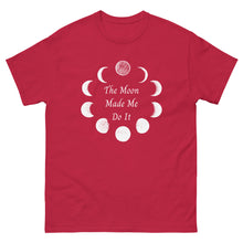 Load image into Gallery viewer, unisex red t-shirt with image phrase: The moon made me do it. Bordered with Moon phases. Front view. Halloween, spooky season.