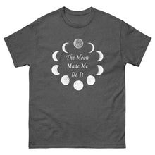 Load image into Gallery viewer, unisex dark heather grey t-shirt with image phrase: The moon made me do it. Bordered with Moon phases. Front view. Halloween, spooky season.