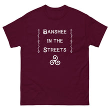 Load image into Gallery viewer, unisex maroon t-shirt with image phrase: Banshee in the Streets. tribal symbols on both sides. Triskele at the bottom under phrase. Front view. Halloween, spooky season.