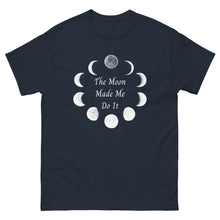 Load image into Gallery viewer, unisex navy blue t-shirt with image phrase: The moon made me do it. Bordered with Moon phases. Front view. Halloween, spooky season.