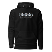 Load image into Gallery viewer, unisex black hoodie with image phrase "The moon made me do it." With image graphic of watercolor moon phases, decorated with random gold star constellations. Front view.