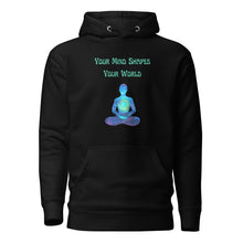 Load image into Gallery viewer, unisex black hoodie with image phrase: "Your mind shapes your world." With a green blue watercolor image graphic of a person's silhouette, in pose of meditation. Front view.