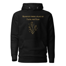 Load image into Gallery viewer, black unisex hoodie, with pockets, with image phrase: "manifest from a place of faith, not fear." with image graphic of flowers, moon, stardust. Front view.