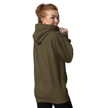 Load image into Gallery viewer, Woman modeling/wearing military army green unisex hoodie, with pockets, with image phrase: "Stay wild, Moon Child." with image of three tribal woman heads, with moon crown, and crescent moons on sides.