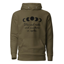 Load image into Gallery viewer, unisex military army green hoodie with image phrase "The soul rests and awakens in cycles." With image graphic of silhouette moon phases with star cut outs. Front view.