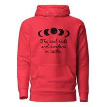 Load image into Gallery viewer, unisex team red hoodie with image phrase "The soul rests and awakens in cycles." With image graphic of silhouette moon phases with star cut outs. Front view.