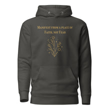 Load image into Gallery viewer, vintage black unisex hoodie, with pockets, with image phrase: "manifest from a place of faith, not fear." with image graphic of flowers, moon, stardust. Front view.