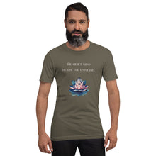 Load image into Gallery viewer, man modeling/wearing unisex army green t-shirt, with image phrase: "The quiet mind hears the Universe." Image of watercolor pink and blue lotus flower floating on water.