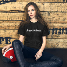 Load image into Gallery viewer, woman modeling/wearing unisex black heather t-shirt, with Image phrase: white text - "Mental Alchemist." Front view.