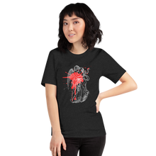 Load image into Gallery viewer, woman modeling/wearing unisex black heather t-shirt, with image design of an angel kissing a woman, with a red paint splat seen through their outlines. Front view.