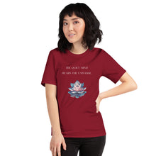 Load image into Gallery viewer, woman modeling/wearing unisex cardinal red t-shirt, with image phrase: "The quiet mind hears the Universe." Image of watercolor pink and blue lotus flower floating on water.