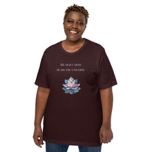 Load image into Gallery viewer, woman modeling/wearing unisex oxblood black t-shirt, with image phrase: "The quiet mind hears the Universe." Image of watercolor pink and blue lotus flower floating on water.
