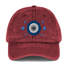 Load image into Gallery viewer, vintage denim cap maroon, with image design of blue eye of protection/evil eye/third eye, with stars. Front view.