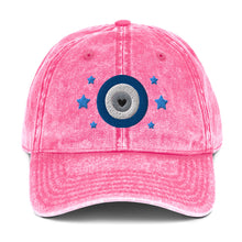 Load image into Gallery viewer, vintage denim cap pink, with image design of blue eye of protection/evil eye/third eye, with stars. Front view.