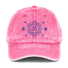 Load image into Gallery viewer, vintage denim cap pink, with image design of purple third eye chakra symbol, and stars. Front view.
