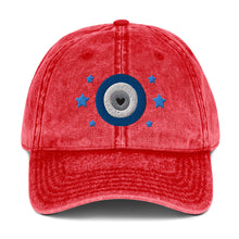 Load image into Gallery viewer, vintage denim cap red, with image design of blue eye of protection/evil eye/third eye, with stars. Front view.