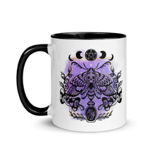 Load image into Gallery viewer, 11 oz. white ceramic coffee/tea mug with solid black handle, rim, and inside. Design: Moth with a skull, moon phases, pentacle, mushrooms, and a crystal vial. left hand side view.