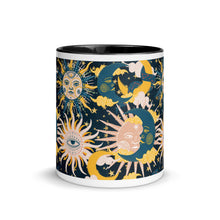 Load image into Gallery viewer, enchanting ceramic coffee tea mug featuring a wraparound image of an abstract sun, moon, and star pattern. black colorful rim, handle, and inside mug. Colors in pattern: golden yellow, dark teal, peach coral. Center view, outside.