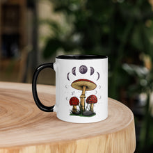 Load image into Gallery viewer, 11 oz. white ceramic coffee/tea mug with solid black handle, rim, and inside. Image Design: Mushroom cluster, moon phases, and constellations. left hand side view.