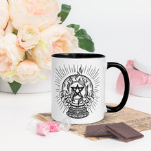 Load image into Gallery viewer, 11 oz. white ceramic coffee/tea mug with solid black handle, rim, and inside. Image Design: crystal ball with flaming pentacle inside, and hands cupping the crystal ball on both sides. right hand side view. Halloween, spooky season.