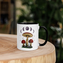 Load image into Gallery viewer, 11 oz. white ceramic coffee/tea mug with solid black handle, rim, and inside. Image Design: Mushroom cluster, moon phases, and constellations. right hand side view.