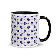 Load image into Gallery viewer, 11 oz. white ceramic coffee/tea mug with solid black handle, rim, and inside. Wrapped around mug is patterned image of eye of protection/evil eye. Right hand side view.