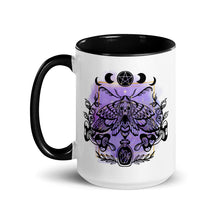 Load image into Gallery viewer, 15 oz. white ceramic coffee/tea mug with solid black handle, rim, and inside. Design: Moth with a skull, moon phases, pentacle, mushrooms, and a crystal vial. left hand side view.