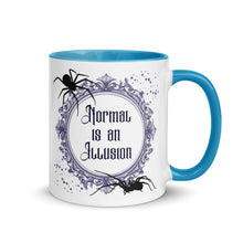 Load image into Gallery viewer, 11 oz. white ceramic coffee/tea mug with solid light blue handle, rim, and inside. Image Design: Words 'Normal is an Illusion' in a elegant border, with spider silhouettes, and stars. Image phrase: Normal is an Illusion. Right hand side view. Halloween, spooky season.
