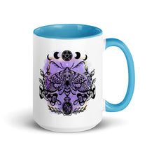 Load image into Gallery viewer, 15 oz. white ceramic coffee/tea mug with solid light blue handle, rim, and inside. Design: Moth with a skull, moon phases, pentacle, mushrooms, and a crystal vial. right hand side view.