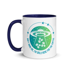 Load image into Gallery viewer, 11 oz. white ceramic coffee/tea mug with solid navy blue handle, rim, and inside. Image Design: ufo ship abducting/beaming up coffee beans. background blue to light green gradient, stars. Text under image: "Don't mind me, I'm only here for the Coffee." left hand side view.