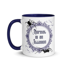 Load image into Gallery viewer, 11 oz. white ceramic coffee/tea mug with solid navy blue handle, rim, and inside. Image Design: Words 'Normal is an Illusion' in a elegant border, with spider silhouettes, and stars. Image phrase: Normal is an Illusion. Left hand side view. Halloween, spooky season.