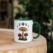Load image into Gallery viewer, 11 oz. white ceramic coffee/tea mug with solid dark green handle, rim, and inside. Image Design: Mushroom cluster, moon phases, and constellations. right hand side view.