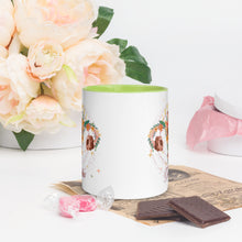 Load image into Gallery viewer, 11 oz. white ceramic coffee/tea mug with solid light green handle, rim, and inside. Image Design: Female reproductive organ, vagina, uterus, ovaries, with leaves and flowers, moon phases above. Outside center view.