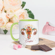Load image into Gallery viewer, 11 oz. white ceramic coffee/tea mug with solid light green handle, rim, and inside. Image Design: Female reproductive organ, vagina, uterus, ovaries, with leaves and flowers, moon phases above. left hand side view.