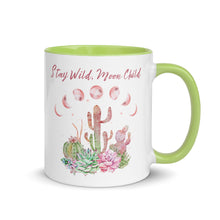 Load image into Gallery viewer, 11 oz. white ceramic coffee/tea mug with solid light green handle, rim, and inside. Image Design: Moon phases, colorful pink and green tinged cacti, with "Stay Wild Moon Child" text. Right hand side view.