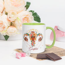 Load image into Gallery viewer, 11 oz. white ceramic coffee/tea mug with solid light green handle, rim, and inside. Image Design: Female reproductive organ, vagina, uterus, ovaries, with leaves and flowers, moon phases above. Right hand side view.