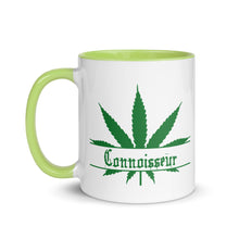 Load image into Gallery viewer, Ceramic coffee/tea mug with solid light green handle, rim, and inside. Image Design: Marijuana leaf with "Connoisseur" text. Left hand side view.